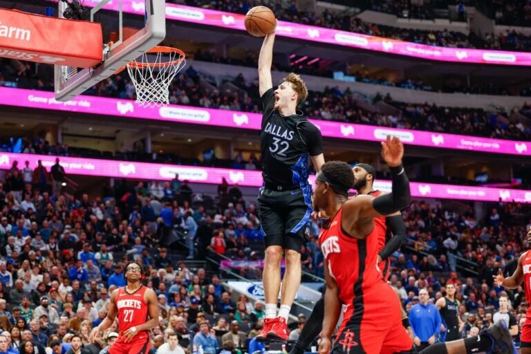 Dallas Mavericks forward Cooper Flagg (32) dunks during the fourth quarter against the Houston Rockets at American Airlines Center.