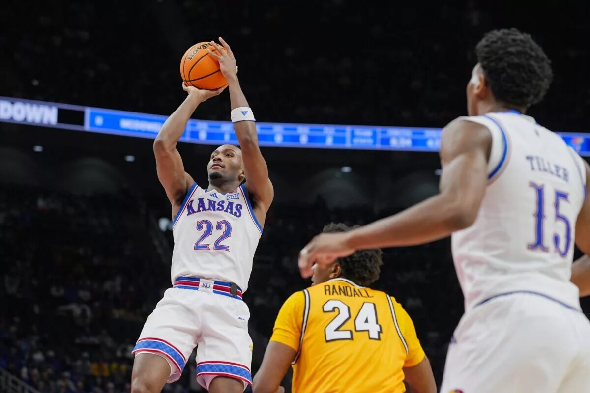 Kansas Jayhawks guard Darryn Peterson (22) shoots against Missouri Tigers forward Nicholas Randall (24) during the first half at T-Mobile Center.
