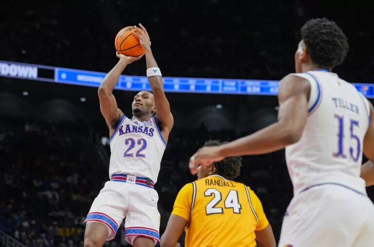 Kansas Jayhawks guard Darryn Peterson (22) shoots against Missouri Tigers forward Nicholas Randall (24) during the first half at T-Mobile Center.