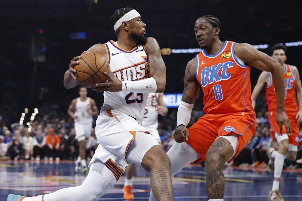 Dec 10, 2025; Oklahoma City, Oklahoma, USA; Phoenix Suns guard Jordan Goodwin (23) drives to the basket against Oklahoma City Thunder guard Jalen Williams (8) during the second quarter at Paycom Center. Mandatory Credit: Alonzo Adams-Imagn Images