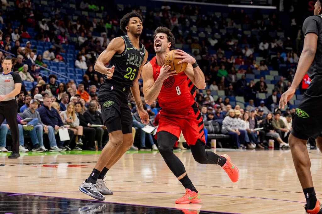 Portland Trail Blazers forward Deni Avdija (8) dribbles against New Orleans Pelicans forward Trey Murphy III (25) during the first half at Smoothie King Center.
