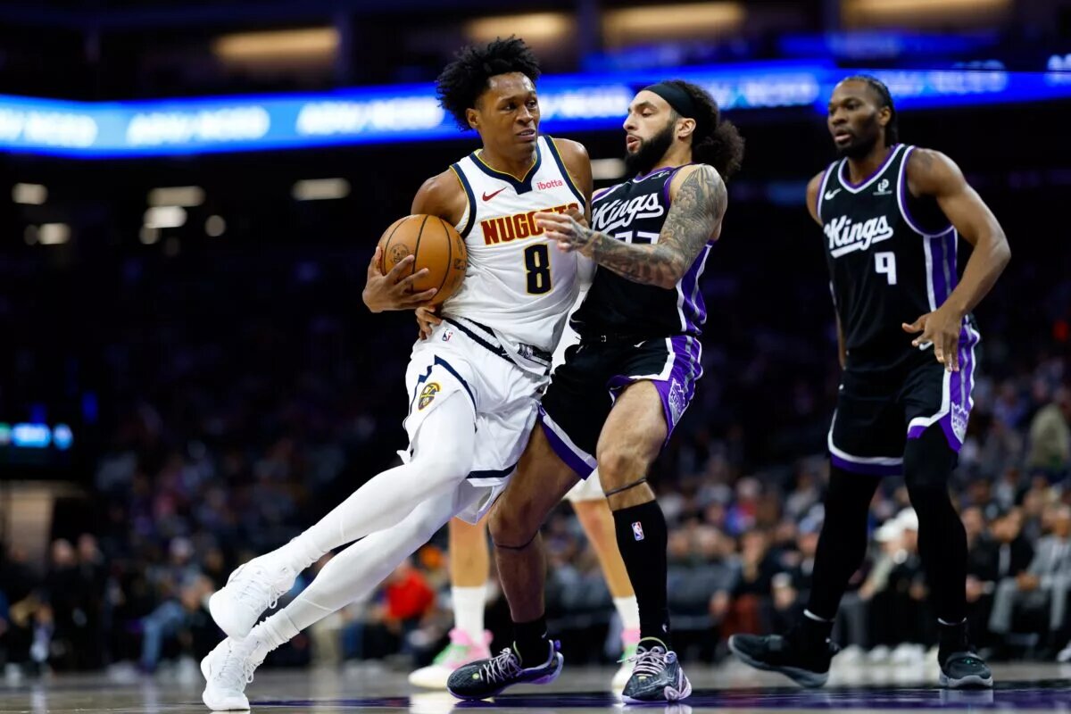 Denver Nuggets guard Peyton Watson (8) drives to the basket against Sacramento Kings guard Devin Carter (22) during the third quarter at Golden 1 Center.