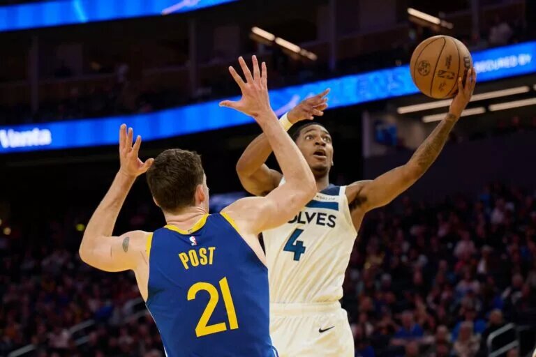 Minnesota Timberwolves guard Rob Dillingham (4) shoots the ball against Golden State Warriors center Quinten Post (21) during the fourth quarter at Chase Center.