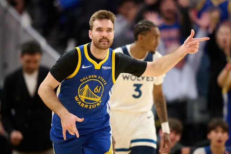 Dec 12, 2025; San Francisco, California, USA; Golden State Warriors guard Pat Spencer (61) acknowledges the Warriors bench after making a three-point shot against the Minnesota Timberwolves during the third quarter at Chase Center. Mandatory Credit: Robert Edwards-Imagn Images
