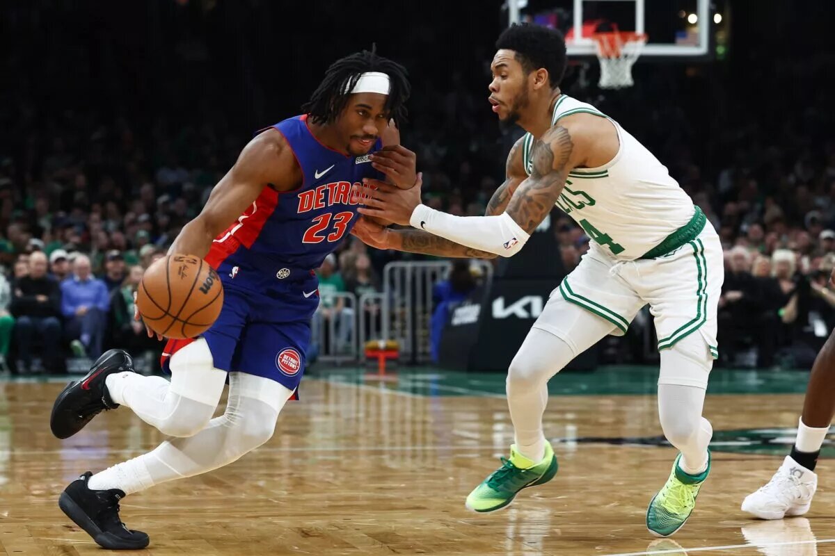 Dec 15, 2025; Boston, Massachusetts, USA; Detroit Pistons guard Jaden Ivey (23) drives on Boston Celtics guard Anfernee Simons (4) during the first quarter at TD Garden. Mandatory Credit: Winslow Townson-Imagn Images