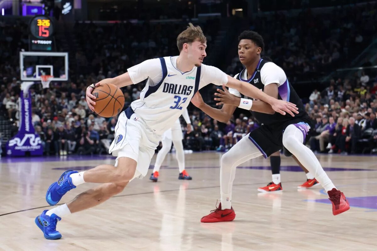 Dec 15, 2025; Salt Lake City, Utah, USA; Dallas Mavericks forward Cooper Flagg (32) drives to the basket against Utah Jazz guard Ace Bailey (19) during the second quarter at Delta Center. Mandatory Credit: Rob Gray-Imagn Images
