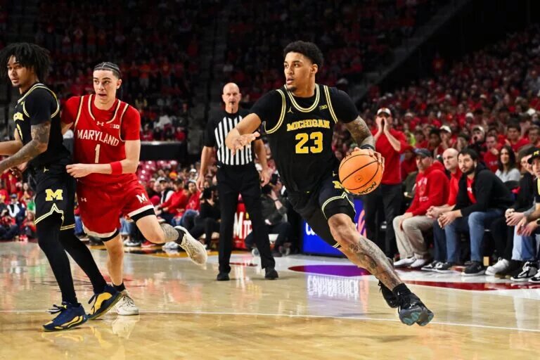 Michigan Wolverines forward Yaxel Lendeborg (23) controls the ball against the Maryland Terrapins at Xfinity Center.