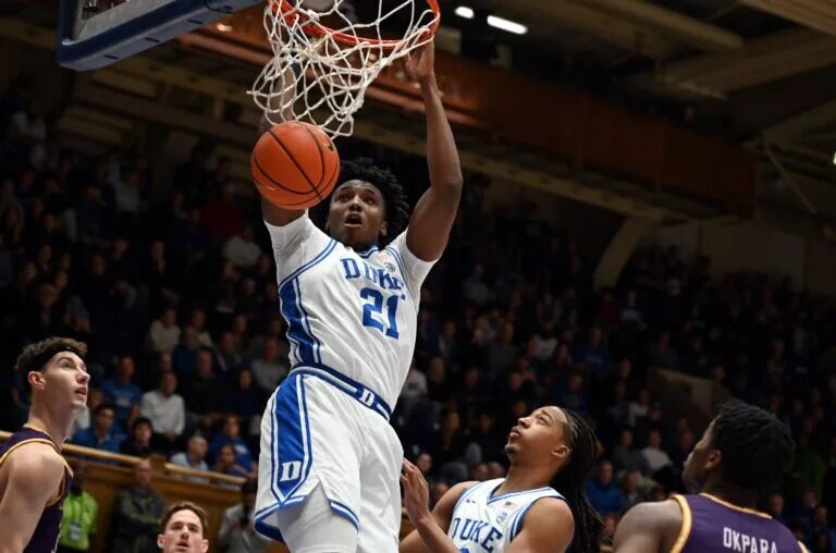 Duke Blue Devils center Patrick Ngongba II (21) dunks during the first half against the Lipscomb Bisons at Cameron Indoor Stadium.