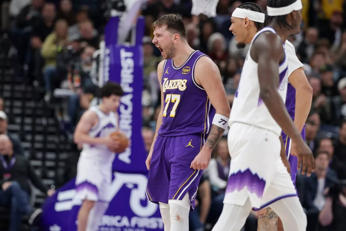 Dec 18, 2025; Salt Lake City, Utah, USA; Los Angeles Lakers forward/guard Luka Doncic (77) celebrates after scoring a three point basket during the second half against the Utah Jazz at Delta Center. Mandatory Credit: Chris Nicoll-Imagn Images