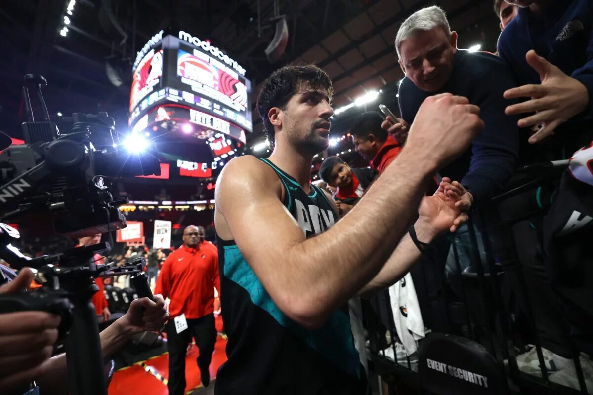 Portland Trail Blazers forward Deni Avdija (8) signs his autograph after the Trail Blazers defeated Sacramento Kings 134-133 in overtime at Moda Center.