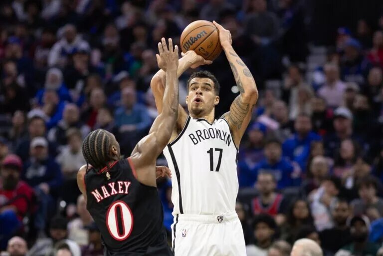 Brooklyn Nets forward Michael Porter Jr. (17) shoots in front of Philadelphia 76ers guard Tyrese Maxey (0) during the second quarter at Xfinity Mobile Arena.