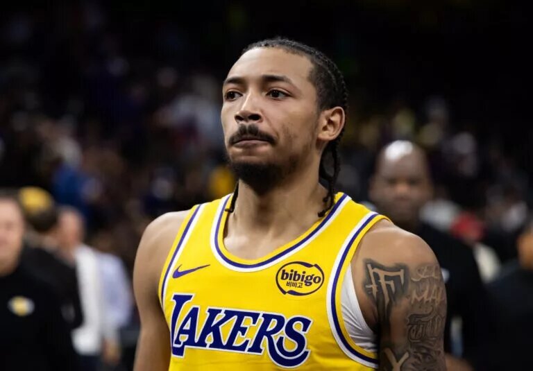 Dec 23, 2025; Phoenix, Arizona, USA; Los Angeles Lakers guard Nick Smith Jr. (20) against the Phoenix Suns at Mortgage Matchup Center. Mandatory Credit: Mark J. Rebilas-Imagn Images