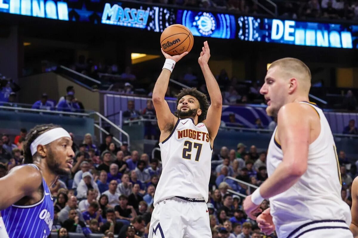 Dec 27, 2025; Orlando, Florida, USA; Denver Nuggets guard Jamal Murray (27) shoots during the second half against the Orlando Magic at Kia Center. Mandatory Credit: Mike Watters-Imagn Images