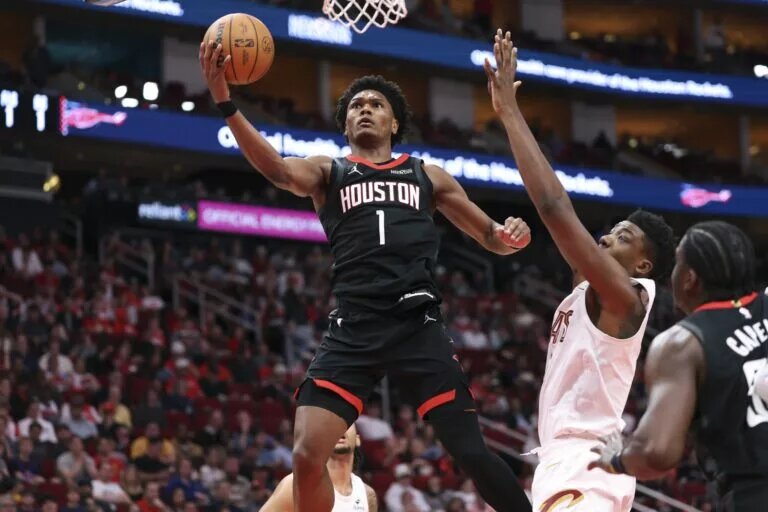 Dec 27, 2025; Houston, Texas, USA; Houston Rockets guard Amen Thompson (1) attempts to score a basket during the third quarter against the Cleveland Cavaliers at Toyota Center. Mandatory Credit: Troy Taormina-Imagn Images