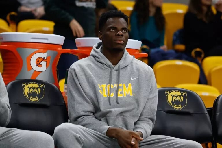 Dec 29, 2025; Waco, Texas, USA; Baylor Bears center James Nnaji (46) in street clothes on the bench during the second half against the Arlington Baptist Patriots at Paul and Alejandra Foster Pavilion. Mandatory Credit: Chris Jones-Imagn Images