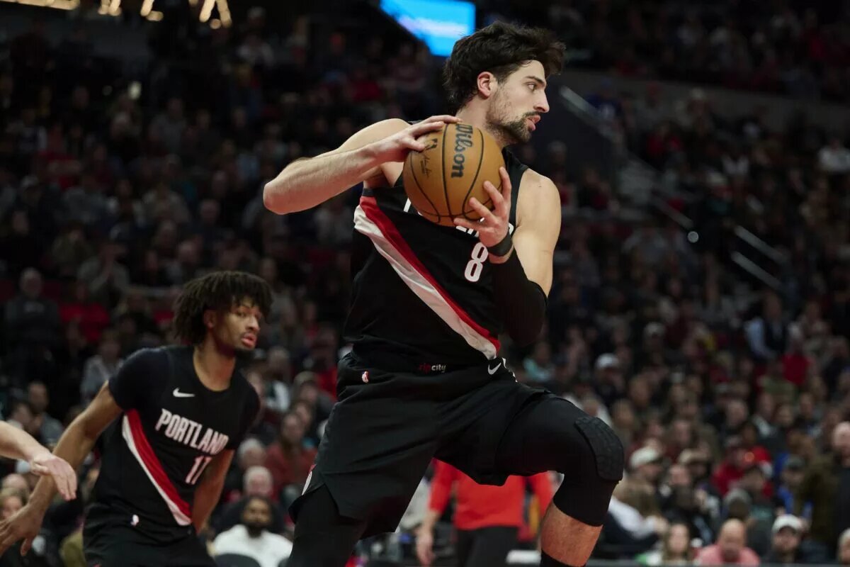 Dec 29, 2025; Portland, Oregon, USA; Portland Trail Blazers forward Deni Avdija (8) grabs a rebound during the second half against the Dallas Mavericks at Moda Center. Mandatory Credit: Troy Wayrynen-Imagn Images