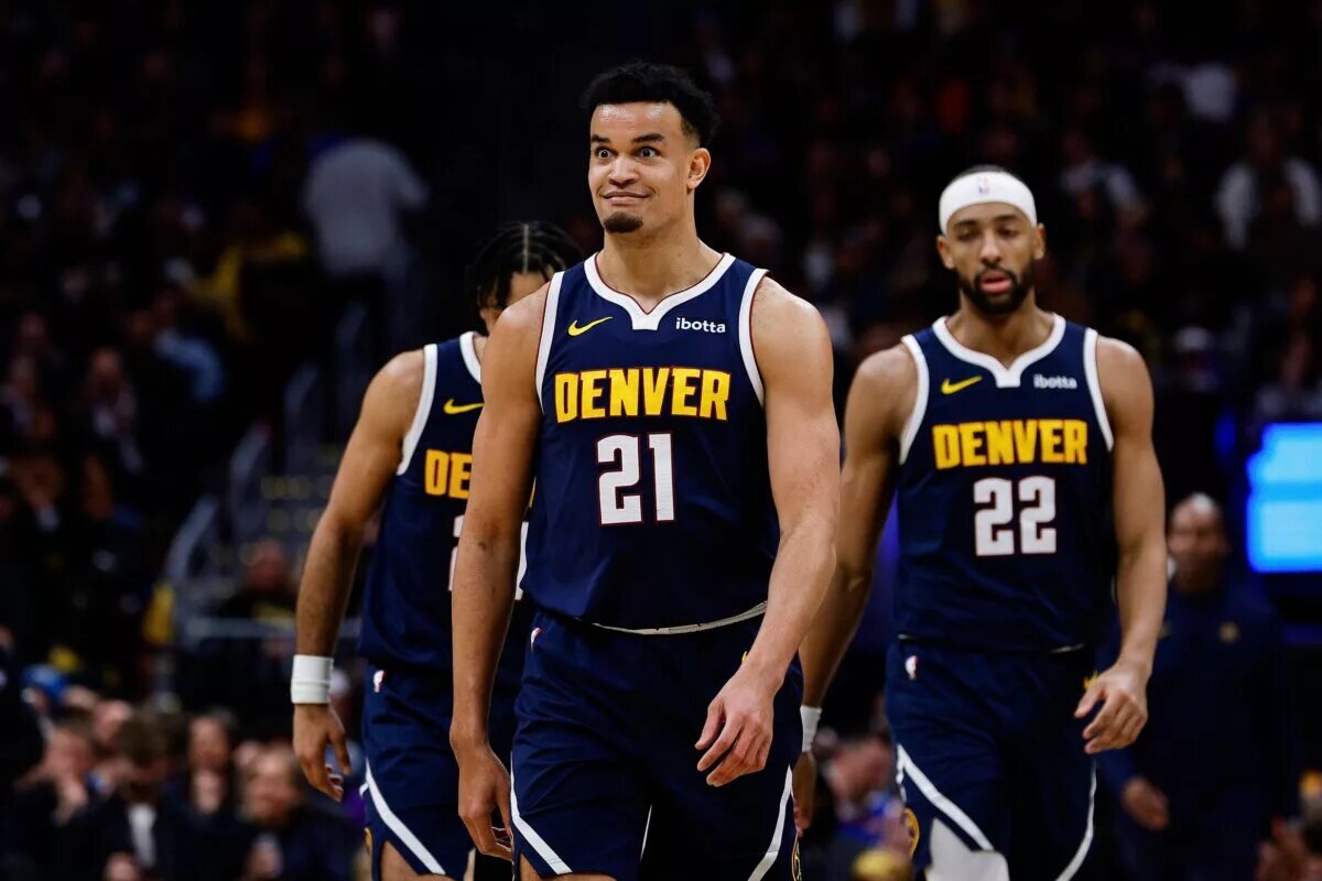 Denver Nuggets forward Spencer Jones (21) reacts after a play in the third quarter against the Los Angeles Lakers at Ball Arena.