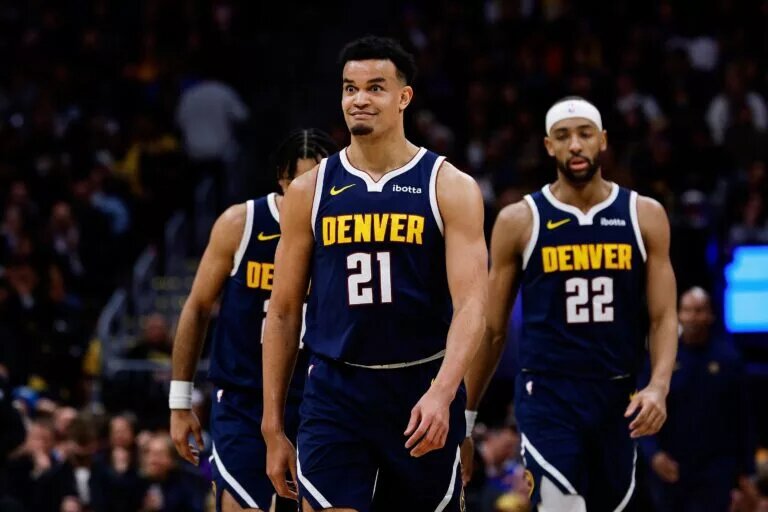 Denver Nuggets forward Spencer Jones (21) reacts after a play in the third quarter against the Los Angeles Lakers at Ball Arena.