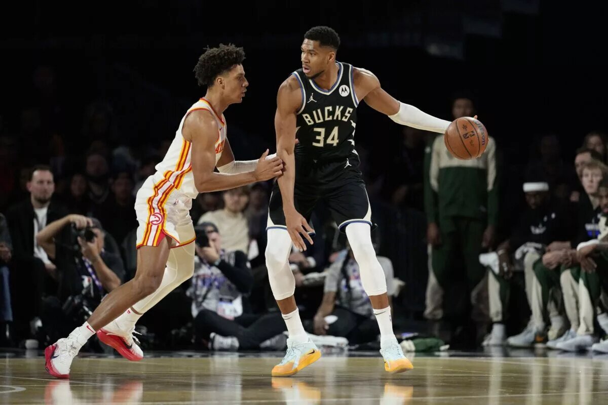 Atlanta Hawks forward Jalen Johnson guards Milwaukee Bucks forward Giannis Antetokounmpo