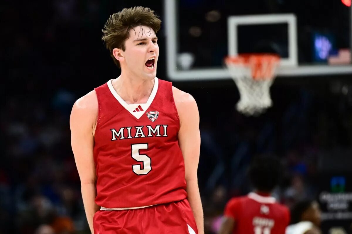 Mar 15, 2025; Cleveland, OH, USA; Miami (Oh) Redhawks guard Peter Suder (5) celebrates after hitting a three point basket against the Akron Zips during the first half of the MAC Conference Tournament Championship game at Rocket Arena. Mandatory Credit: Ken Blaze-Imagn Images