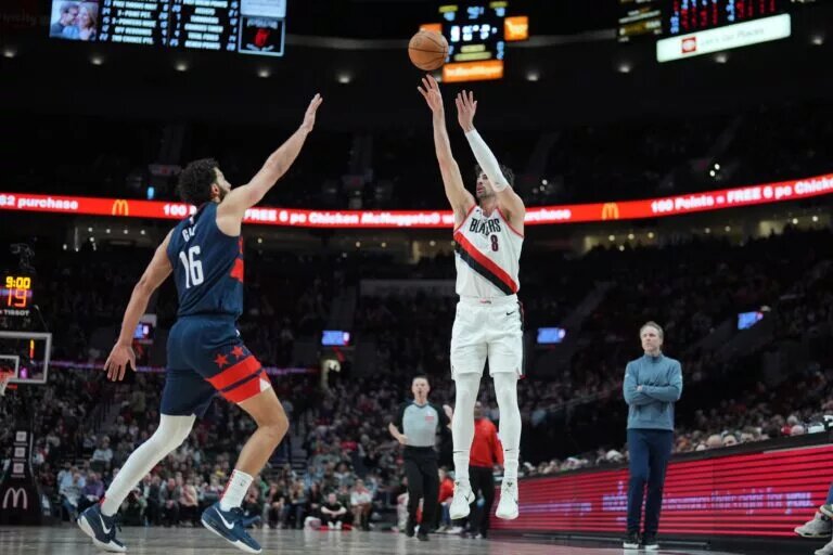Mar 17, 2025; Portland, Oregon, USA; Portland Trail Blazers small forward Deni Avdija (8) shoots over Washington Wizards power forward Anthony Gill (16) during the second half at Moda Center. Mandatory Credit: Soobum Im-Imagn Images