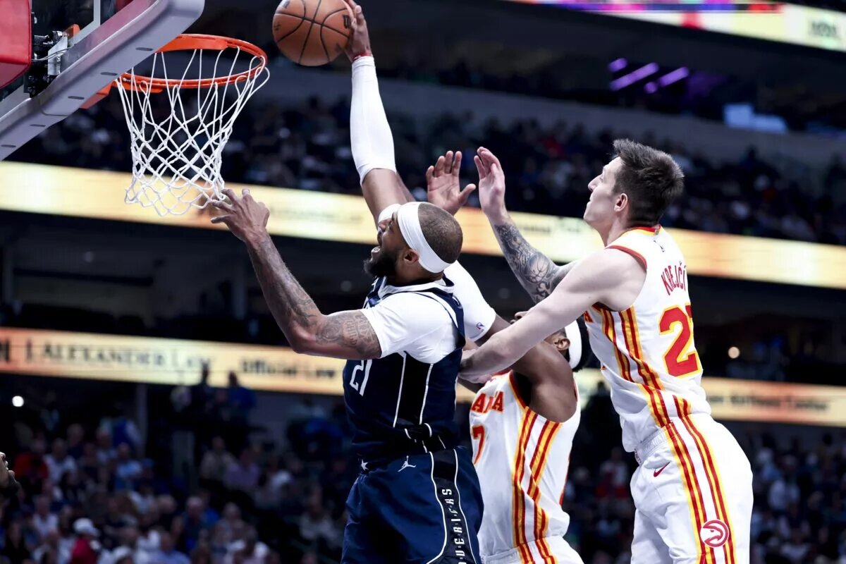 Dallas Mavericks center Daniel Gafford dunks past Atlanta Hawks defenders