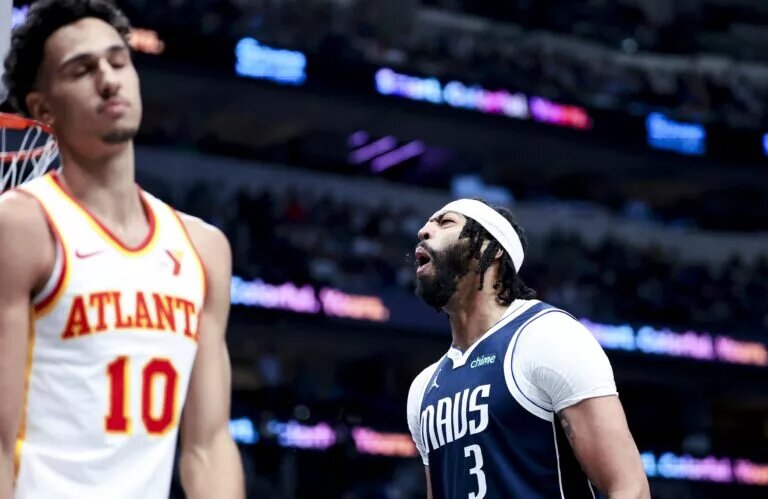 Apr 2, 2025; Dallas, Texas, USA; Dallas Mavericks forward Anthony Davis (3) reacts in front of Atlanta Hawks forward Zaccharie Risacher (10) during the third quarter at American Airlines Center. Mandatory Credit: Kevin Jairaj-Imagn Images