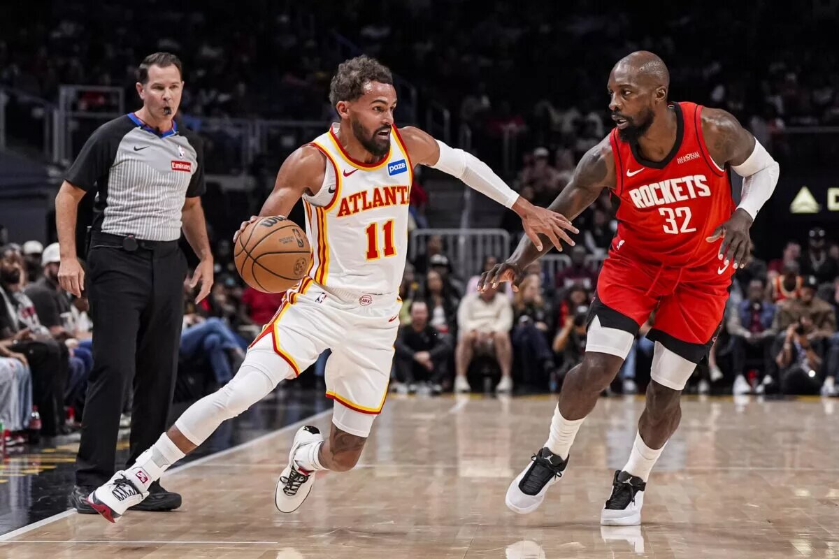 Oct 16, 2025; Atlanta, Georgia, USA; Atlanta Hawks guard Trae Young (11) dribbles against Houston Rockets forward Jeff Green (32) during the first half at State Farm Arena. Mandatory Credit: Dale Zanine-Imagn Images
