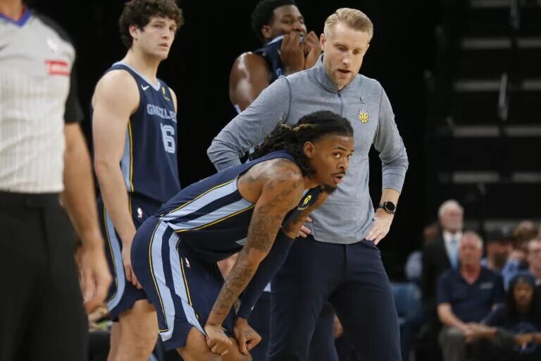 Memphis Grizzlies point guard Ja Morant on the sidelines against the Miami Heat