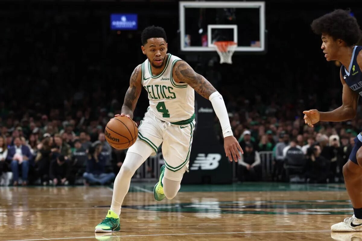 Boston Celtics guard Anfernee Simons attacks Memphis Grizzlies defender Jaylen Wells