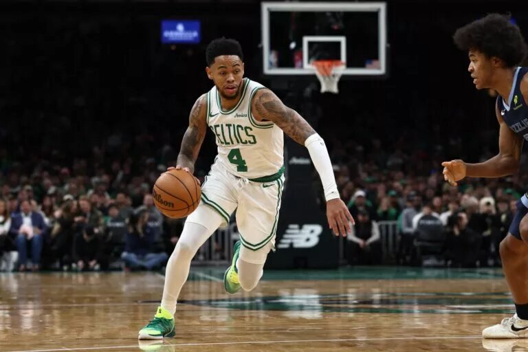 Boston Celtics guard Anfernee Simons attacks Memphis Grizzlies defender Jaylen Wells