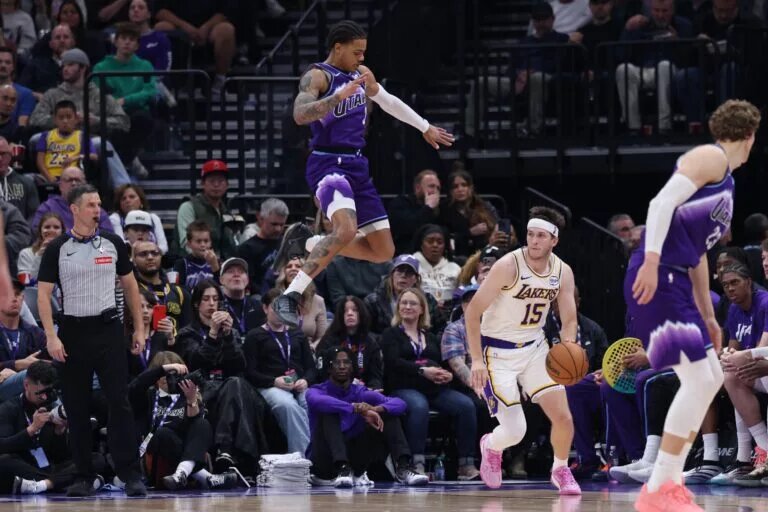 Los Angeles Lakers guard Austin Reaves fakes out Utah Jazz defense