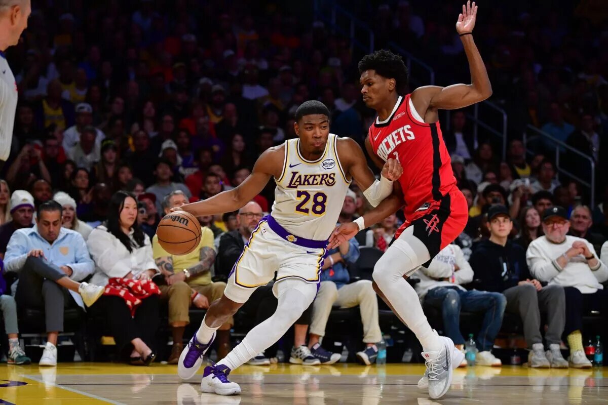 Dec 25, 2025; Los Angeles, California, USA; Los Angeles Lakers forward Rui Hachimura (28) moves to the basket against Houston Rockets guard Amen Thompson (1) during the first half at Crypto.com Arena. Mandatory Credit: Gary A. Vasquez-Imagn Images