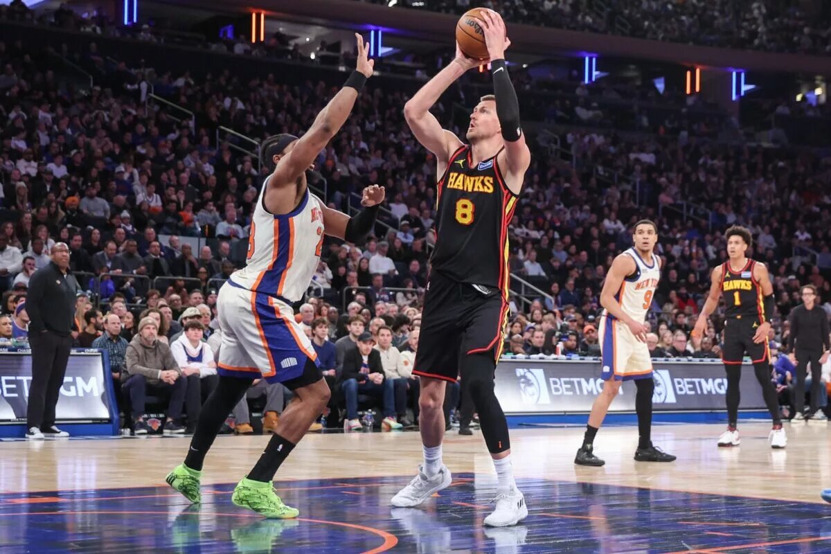 Jan 2, 2026; New York, New York, USA; Atlanta Hawks center Kristaps Porzingis (8) shoots past New York Knicks forward Guerschon Yabusele (28) in the third quarter at Madison Square Garden. Mandatory Credit: Wendell Cruz-Imagn Images