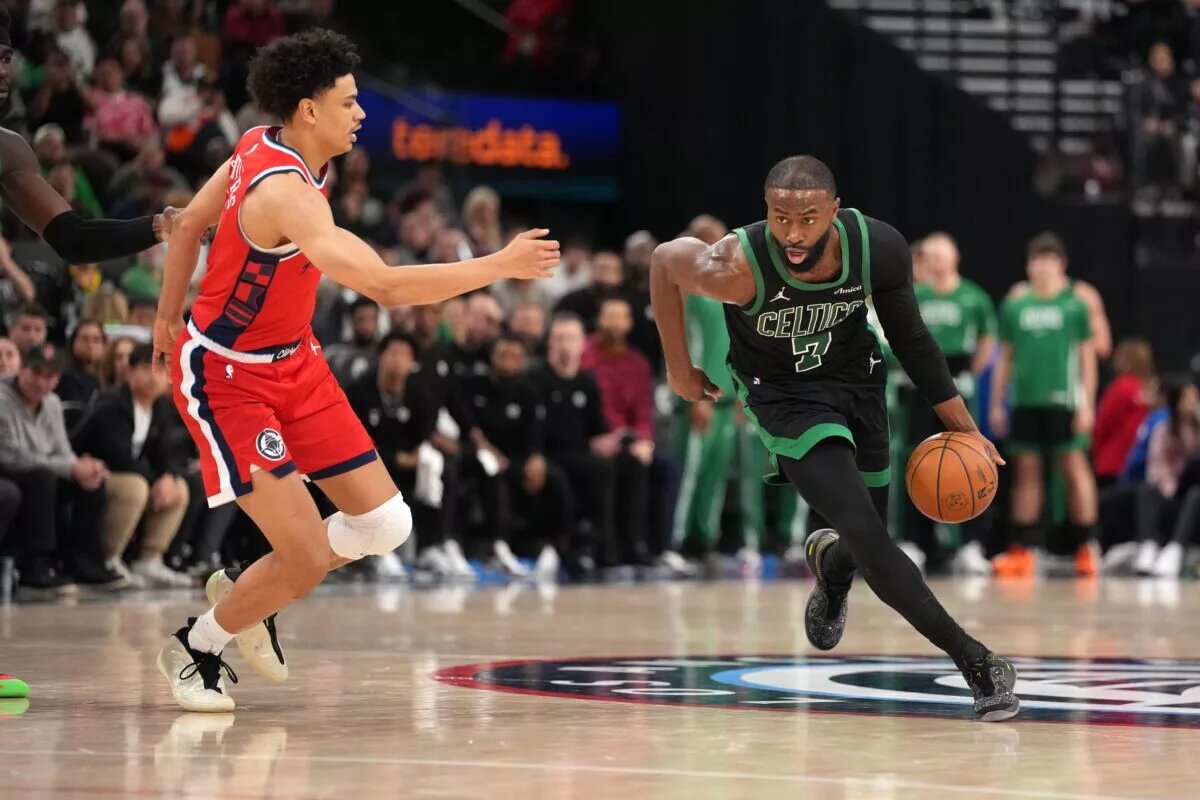 Boston Celtics guard Jaylen Brown (7) dribbles the ball against LA Clippers guard Kobe Sanders (4) in the second half at Intuit Dome.