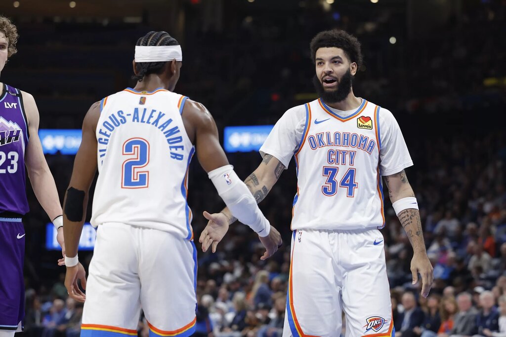 Oklahoma City Thunder guard/forward Kenrich Williams (34) and Oklahoma City Thunder guard Shai Gilgeous-Alexander (2) celebrate after a play against the Utah Jazz during the second half at Paycom Center.
