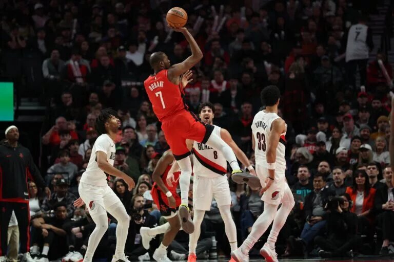 Houston Rockets forward Kevin Durant (7) shoots the ball over Portland Trail Blazers forward Toumani Camara (33) during the second half at Moda Center.