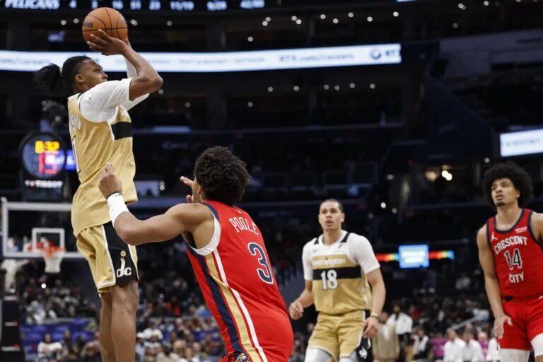 Jan 9, 2026; Washington, District of Columbia, USA; Washington Wizards guard Bub Carrington (7) shoots the ball over New Orleans Pelicans guard Jordan Poole (3) in the second half at Capital One Arena. Mandatory Credit: Geoff Burke-Imagn ImagesJan 9, 2026; Washington, District of Columbia, USA; Washington Wizards guard Bub Carrington (7) shoots the ball over New Orleans Pelicans guard Jordan Poole (3) in the second half at Capital One Arena. Mandatory Credit: Geoff Burke-Imagn Images