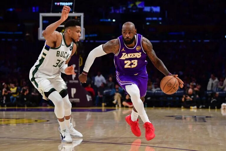 Los Angeles Lakers star LeBron James drives past Milwaukee Bucks trade candidate Giannis Antetokounmpo