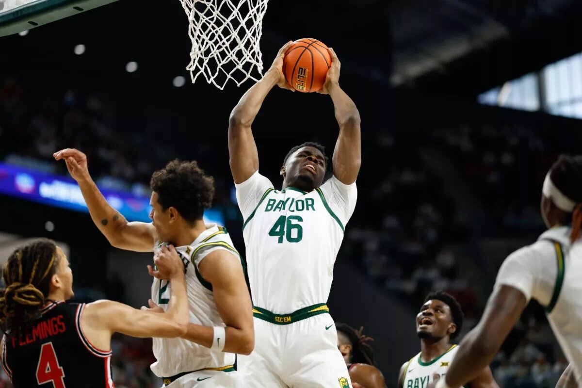 Jan 10, 2026; Waco, Texas, USA; Baylor Bears guard James NNaji (46) grabs a rebound against the Houston Cougars during the first half at Paul and Alejandra Foster Pavilion. Mandatory Credit: Chris Jones-Imagn Images