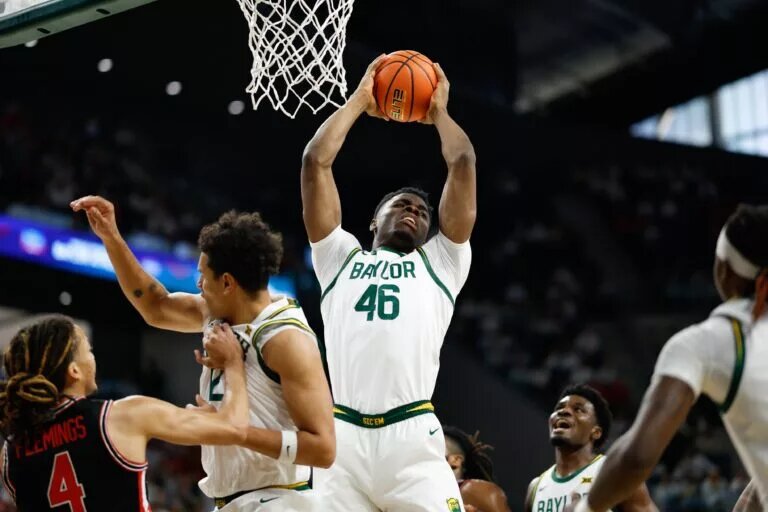 Jan 10, 2026; Waco, Texas, USA; Baylor Bears guard James NNaji (46) grabs a rebound against the Houston Cougars during the first half at Paul and Alejandra Foster Pavilion. Mandatory Credit: Chris Jones-Imagn Images