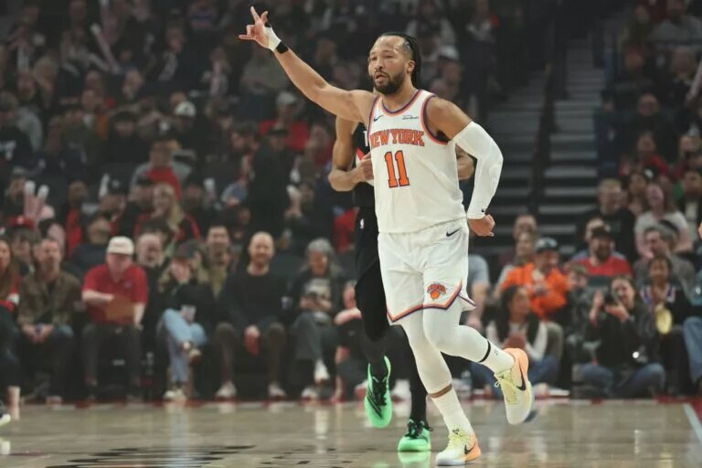 Jan 11, 2026; Portland, Oregon, USA; New York Knicks guard Jalen Brunson (11) reacts after scoring a three-point shot against the Portland Trail Blazers during the first half at Moda Center. Mandatory Credit: Jaime Valdez-Imagn Images