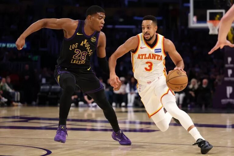 Atlanta Hawks guard CJ McCollum (3) drives to the basket against Los Angeles Lakers forward Rui Hachimura (28) during the first half at Crypto.com Arena.