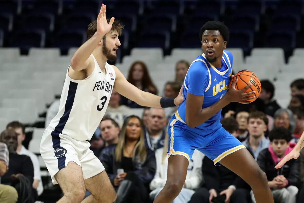 UCLA's Xavier Booker looks to pass against Penn State