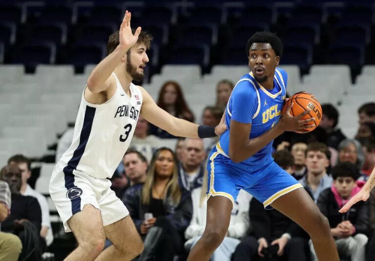 UCLA's Xavier Booker looks to pass against Penn State