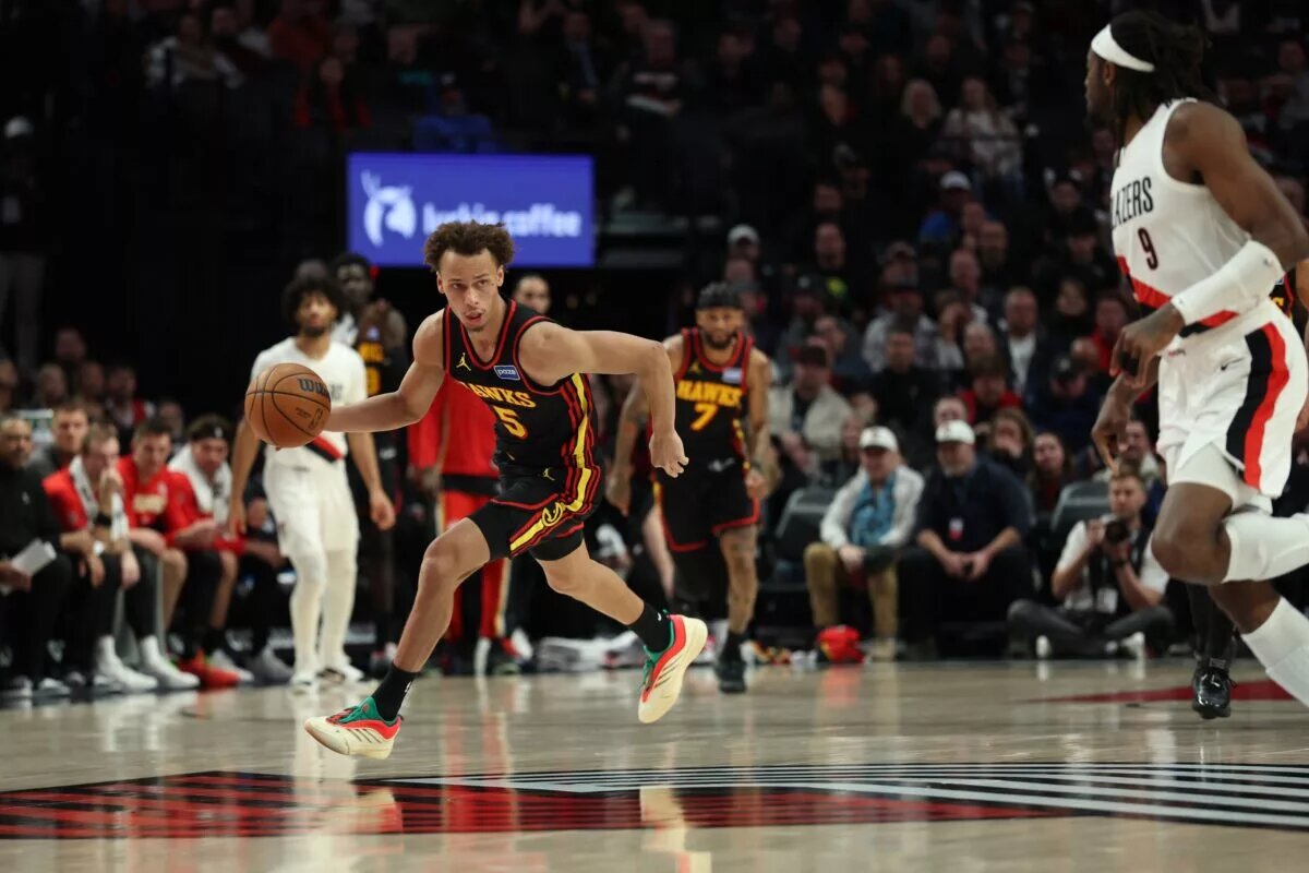 Atlanta Hawks guard Dyson Daniels (5) dribbles the ball past Portland Trail Blazers forward Jerami Grant (9) during the second half at Moda Center.