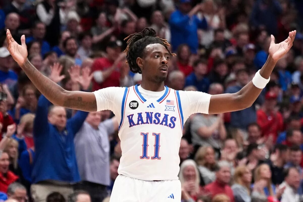 Jan 16, 2026; Lawrence, Kansas, USA; Kansas Jayhawks guard Jamari McDowell (11) celebrates after a score against the Baylor Bears during the second half of the game at Allen Fieldhouse. Mandatory Credit: Denny Medley-Imagn Images