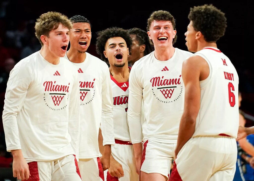 Miami (OH) RedHawks players cheer for Miami (OH) RedHawks guard Justin Kirby (6) after a dunk in the second half of a NCAA men’s basketball game between the Miami RedHawks and Buffalo Bulls, Saturday, Jan. 17, 2026, at Millett Hall in Oxford, Oh. RedHawks won 105-102.