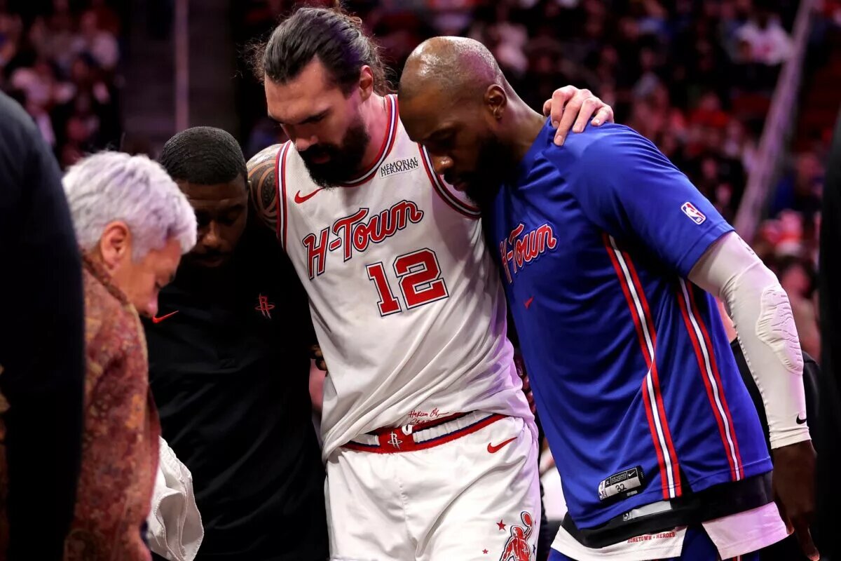 Houston Rockets center Steven Adams (12) is helped off the court after an injury against the New Orleans Pelicans during the fourth quarter at Toyota Center.