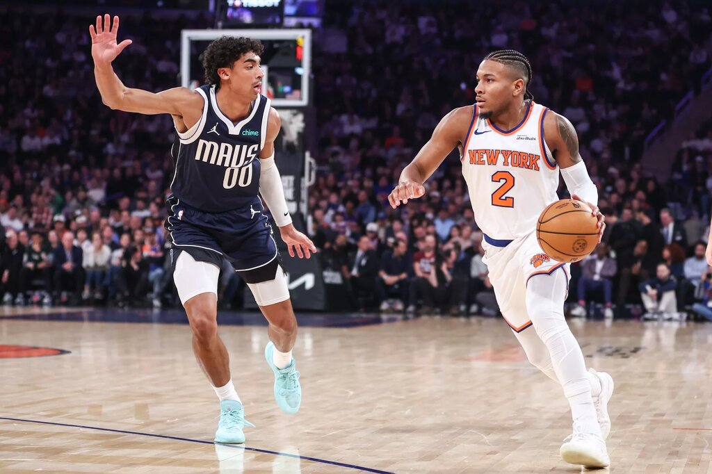 Jan 19, 2026; New York, New York, USA; New York Knicks guard Miles McBride (2) looks to drive past Dallas Mavericks guard Max Christie (00) in the first quarter at Madison Square Garden. Mandatory Credit: Wendell Cruz-Imagn Images